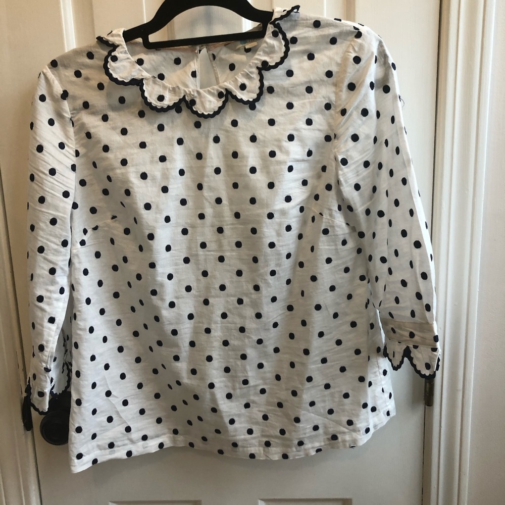 Beautiful embroidery detail at sleeves and collar